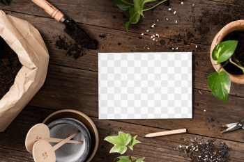 Png paper mockup on wooden table with plants… | Free stock illustration | High Resolution graphic