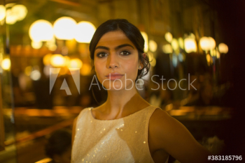 Portrait confident beautiful young woman in cocktail dress