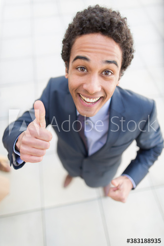 Portrait confident businessman gesturing thumbs up Portrait confident businessman gesturing thumbs up