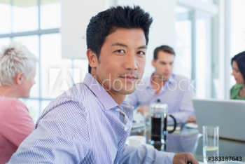 Portrait confident businessman in meeting Portrait confident businessman in meeting
