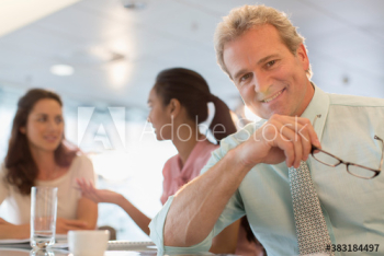 Portrait confident businessman in office meeting Portrait confident businessman in office meeting