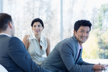Portrait confident businessman with colleagues Portrait confident businessman with colleagues