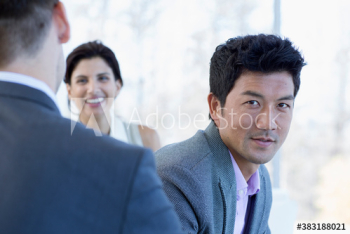 Portrait confident businessman with colleagues Portrait confident businessman with colleagues