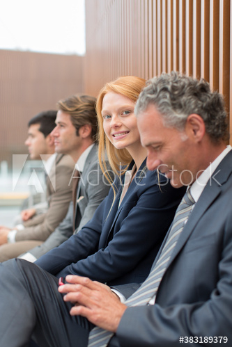 Portrait confident businesswoman with colleagues Portrait confident businesswoman with colleagues