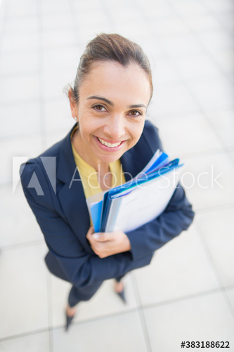 Portrait confident businesswoman with paperwork Portrait confident businesswoman with paperwork