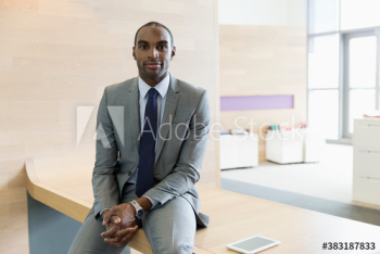 Portrait confident corporate businessman in office Portrait confident corporate businessman in office