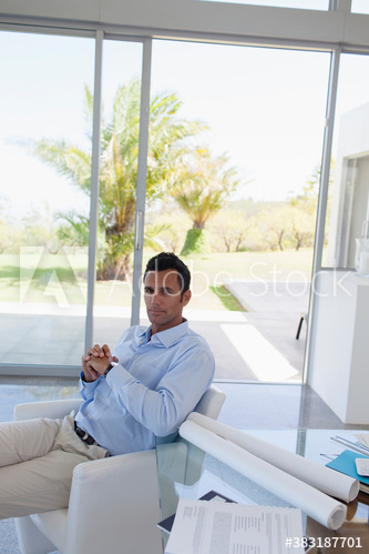 Portrait confident male architect working in office Portrait confident male architect working in office