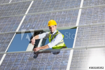 Portrait confident male engineer fixing solar panel Portrait confident male engineer fixing solar panel