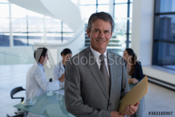 Portrait confident male hospital administrator in meeting Portrait confident male hospital administrator in meeting