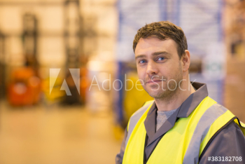 Portrait confident male worker in distribution warehouse Portrait confident male worker in distribution warehouse