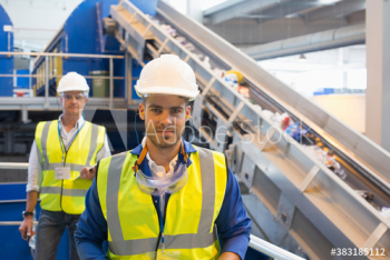 Portrait confident male workers in recycling plant Portrait confident male workers in recycling plant