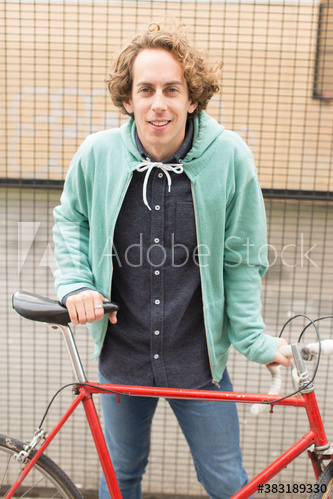 Portrait confident man with bicycle Portrait confident man with bicycle