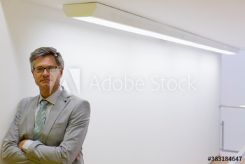 Portrait confident mature corporate businessman in suit Portrait confident mature corporate businessman in suit