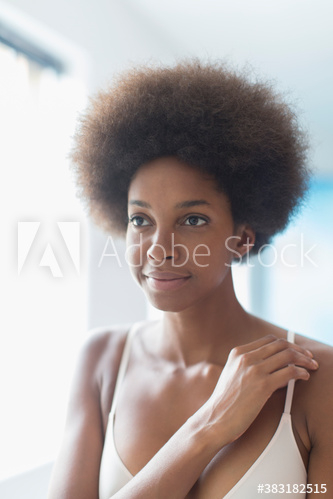 Portrait confident young woman with afro in bra Portrait confident young woman with afro in bra