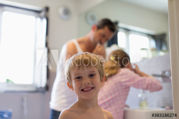 Portrait cute boy in bathroom with family Portrait cute boy in bathroom with family