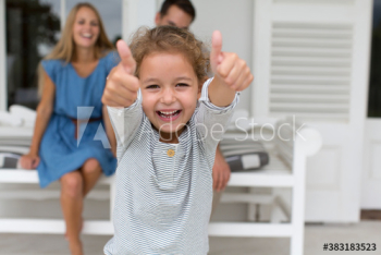 Portrait enthusiastic girl gesturing thumbs up Portrait enthusiastic girl gesturing thumbs up