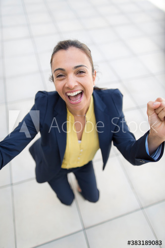 Portrait happy businesswoman celebrating