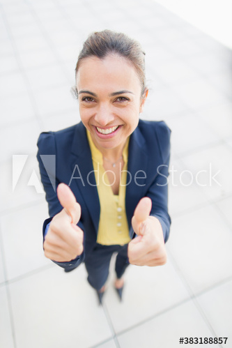 Portrait happy businesswoman gesturing thumbs up Portrait happy businesswoman gesturing thumbs up