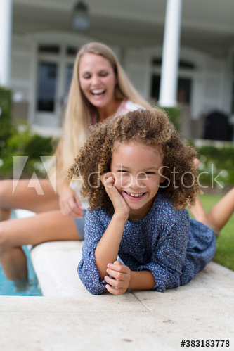 Portrait happy carefree girl at poolside Portrait happy carefree girl at poolside
