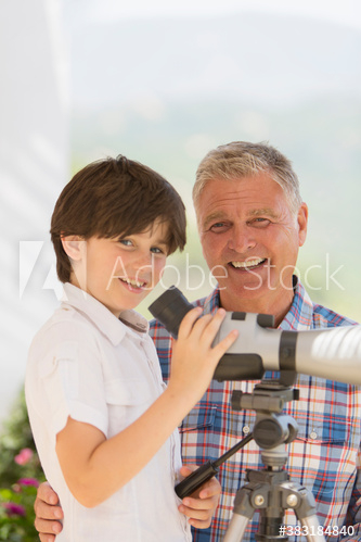 Portrait happy grandfather and grandson using telescope Portrait happy grandfather and grandson using telescope
