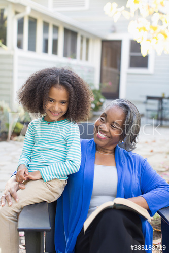 Portrait happy grandmother and granddaughter on patio Portrait happy grandmother and granddaughter on patio