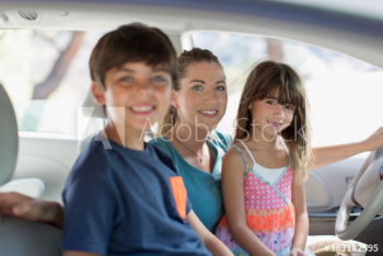Portrait happy mother and children inside car Portrait happy mother and children inside car