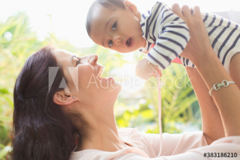 Portrait happy mother holding cute baby son Portrait happy mother holding cute baby son