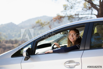 Portrait happy woman driving car Portrait happy woman driving car