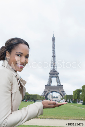 Portrait happy woman gesturing in front of Eiffel Tower, Paris Portrait happy woman gesturing in front of Eiffel Tower, Paris