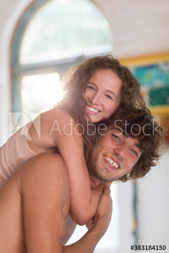 Portrait happy young couple hugging Portrait happy young couple hugging