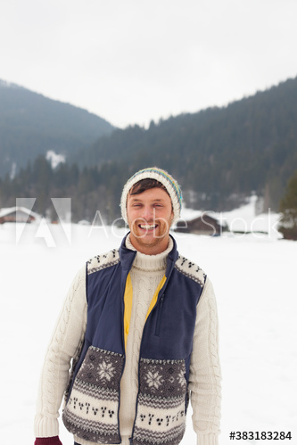 Portrait happy young man in snowy field Portrait happy young man in snowy field