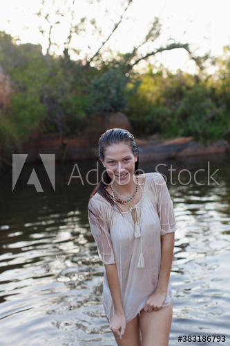 Portrait happy young woman swimming in lake Portrait happy young woman swimming in lake