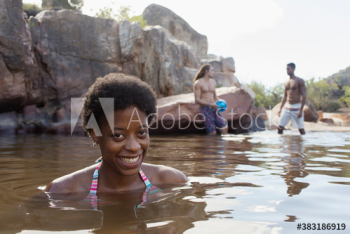 Portrait happy young woman swimming in lake Portrait happy young woman swimming in lake