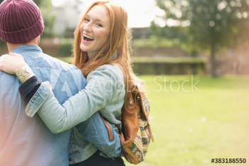 Portrait happy young young woman with boyfriend in park Portrait happy young young woman with boyfriend in park