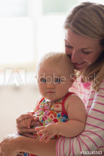 Portrait mother holding cute baby daughter Portrait mother holding cute baby daughter