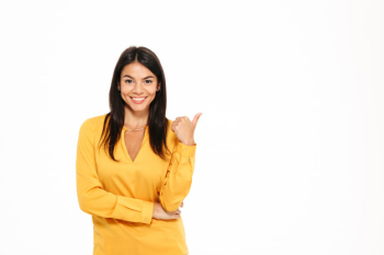 Portrait of a smiling attractive woman pointing finger Free Photo Portrait of a smiling attractive woman pointing finger Free Photo