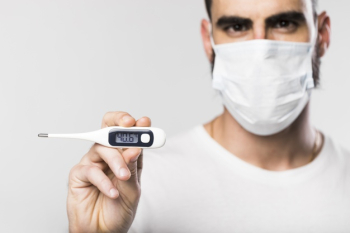Portrait of adult male holding a thermometer Free Photo Portrait of adult male holding a thermometer Free Photo