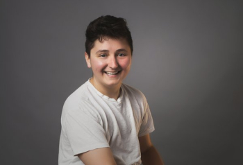 Portrait Of An Androgynous Person Smiling Portrait Of An Androgynous Person Smiling