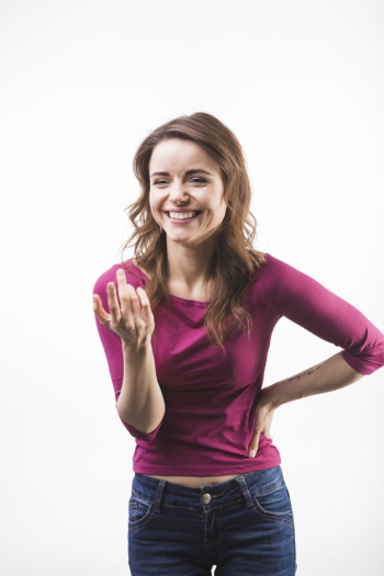 Portrait of laughing young woman gesturing Portrait of laughing young woman gesturing