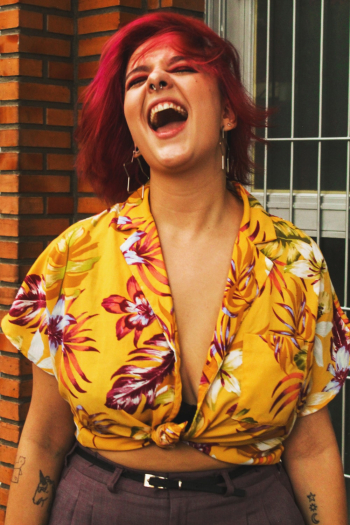 Portrait Of Woman Wearing Yellow Floral Crop Top Portrait Of Woman Wearing Yellow Floral Crop Top