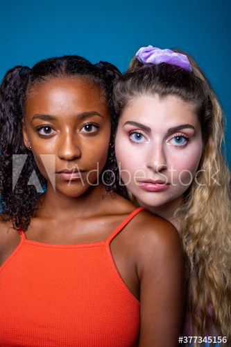 Portrait of young women standing indoors Portrait of young women standing indoors