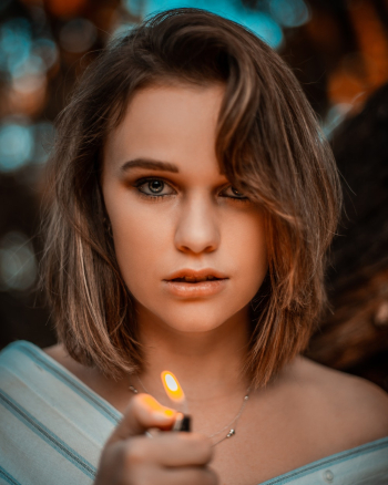 Portrait Photography of Woman Holding Lighter Portrait Photography of Woman Holding Lighter