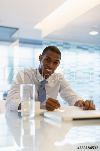 Portrait smiling businessman working in office Portrait smiling businessman working in office