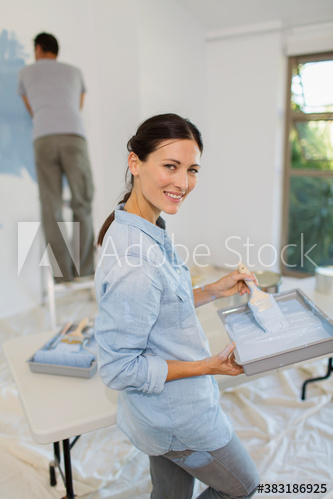 Portrait smiling woman painting at home Portrait smiling woman painting at home
