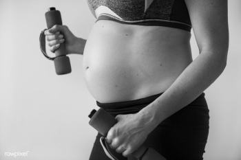 Pregnant woman doing light exercise | Free stock photo - 381939