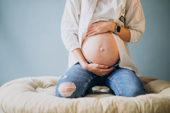 Pregnant woman holding her belly Free Photo