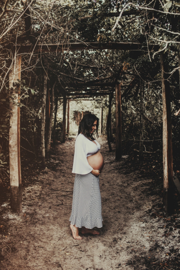 Pregnant Woman Wearing White Dress