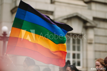 Pride parade with gay rainbow flag in the city Pride parade with gay rainbow flag in the city