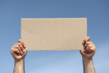 Protester holding board with mock-up Free Photo