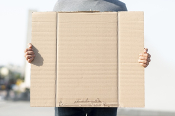 Protester holding cardboard with mock-up Free Photo